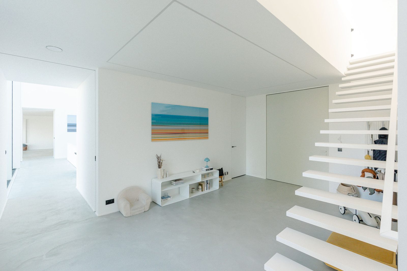 Light grey polished concrete floor in a contemporary house in Brussels